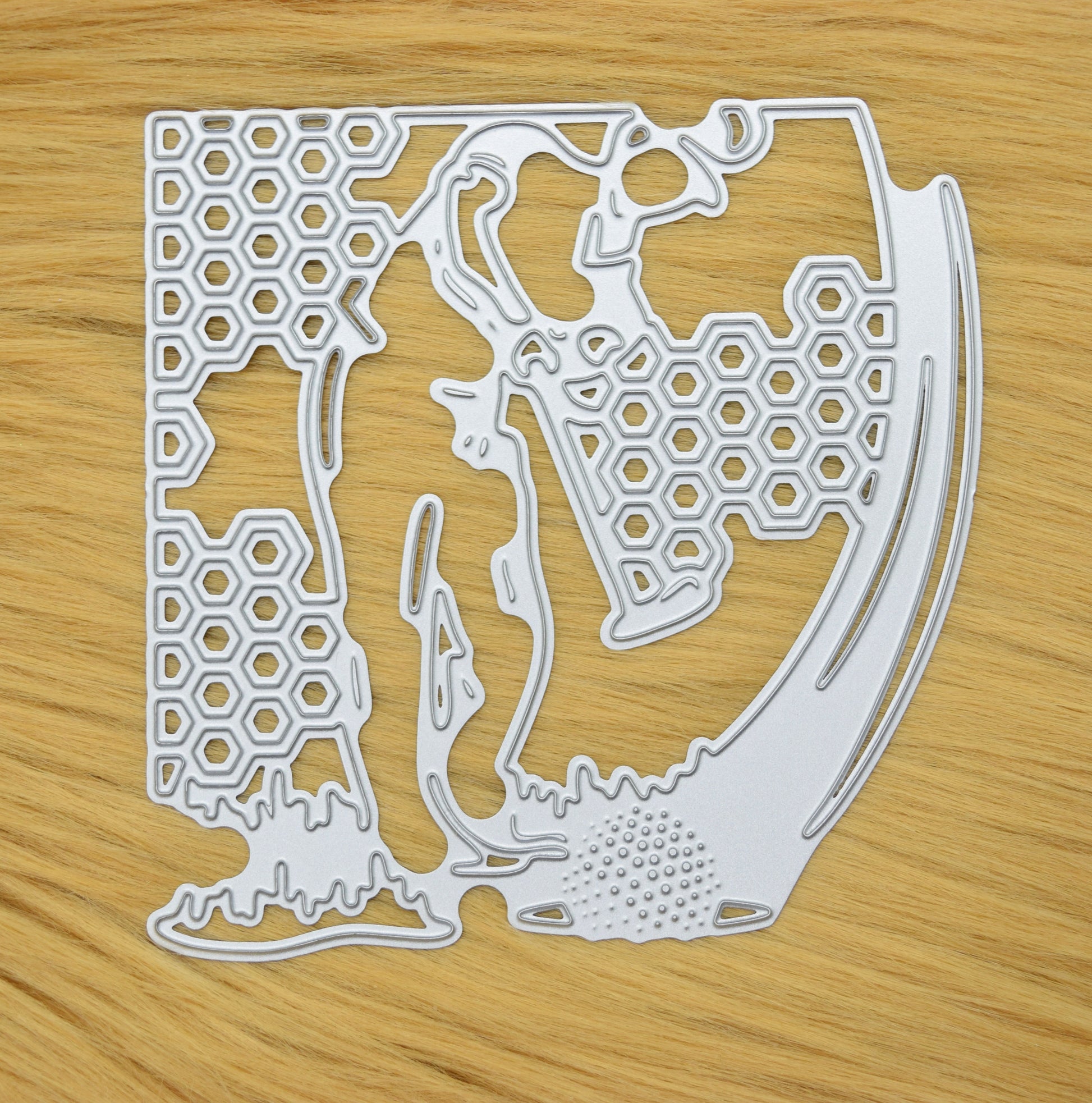 Golfer silhouette metal cutting die displayed on fur surface