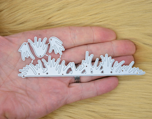 Grass border metal cutting dies set held in hand showing size