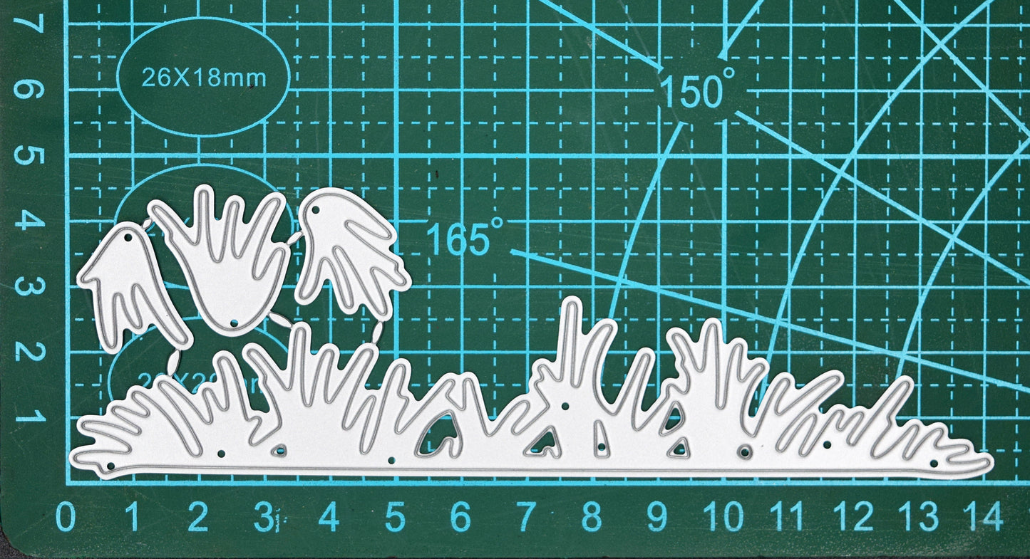 Grass border metal cutting dies on cutting mat showing measurements