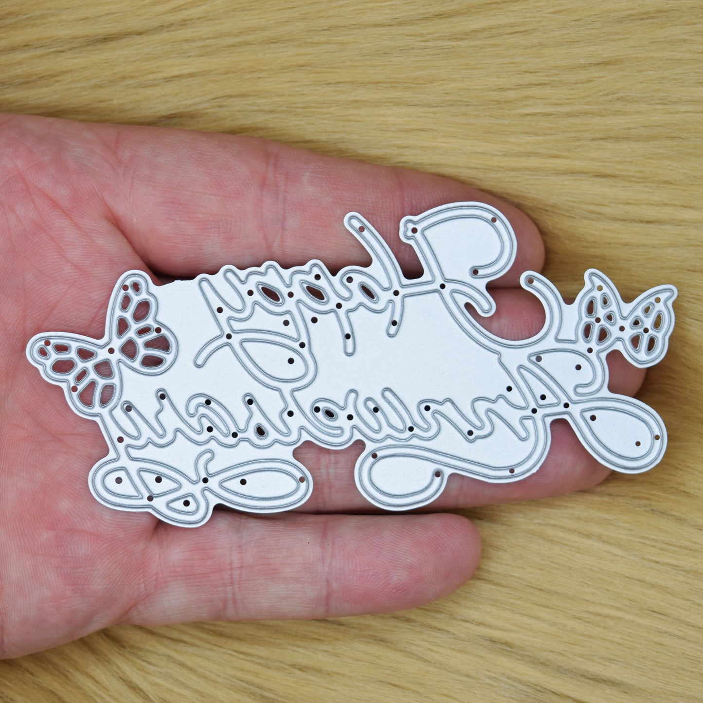 Happy Anniversary butterfly metal cutting die held in hand to show size for card making