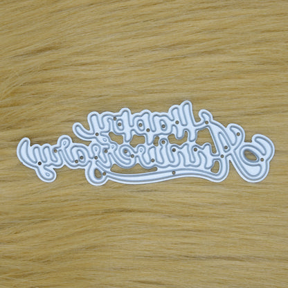 Happy Anniversary script sentiment metal cutting die displayed on a faux fur background.