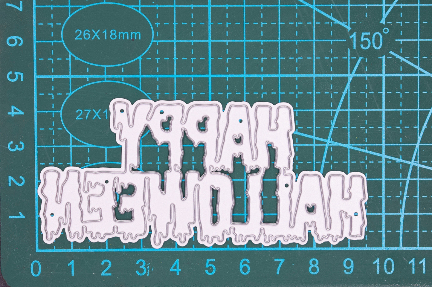 Happy Halloween metal cutting die on cutting mat showing size