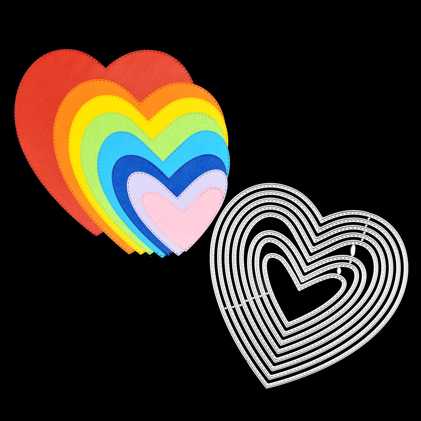 Heart metal cutting dies alongside layered heart die cut shapes for card making