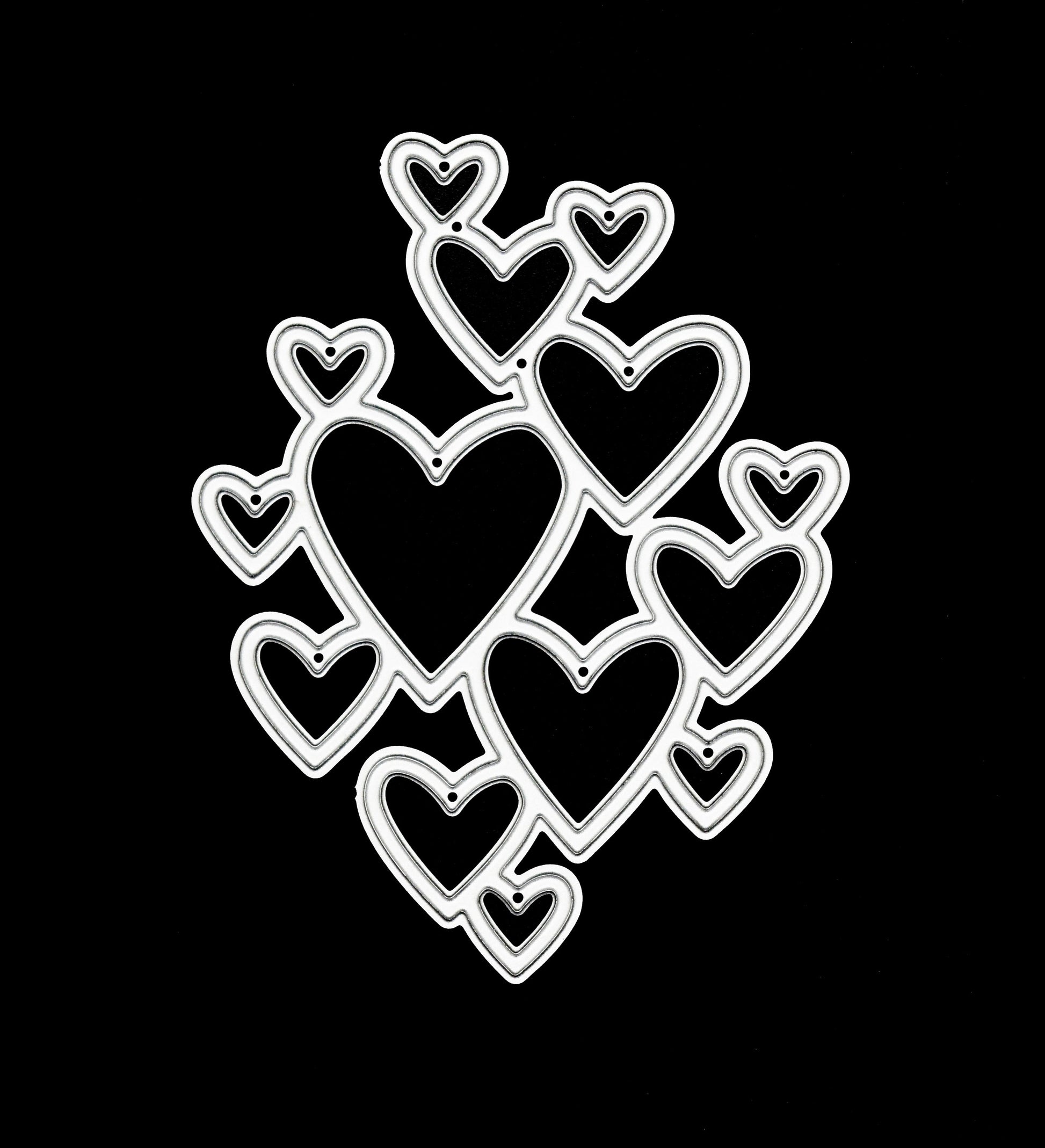 Heart cluster metal cutting die on black background