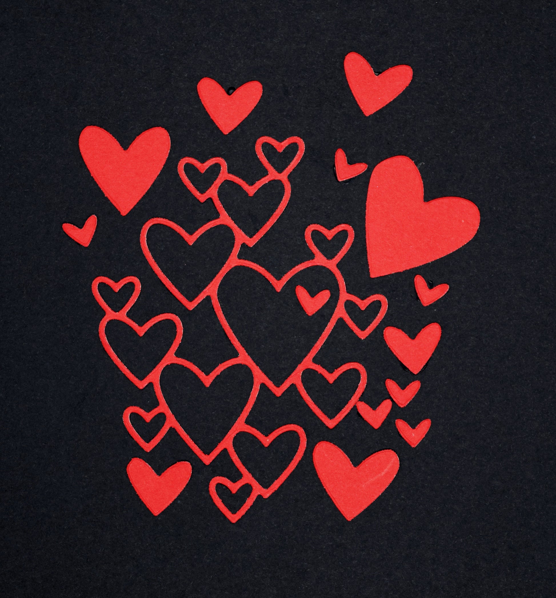 Heart cluster die cut shapes in red card