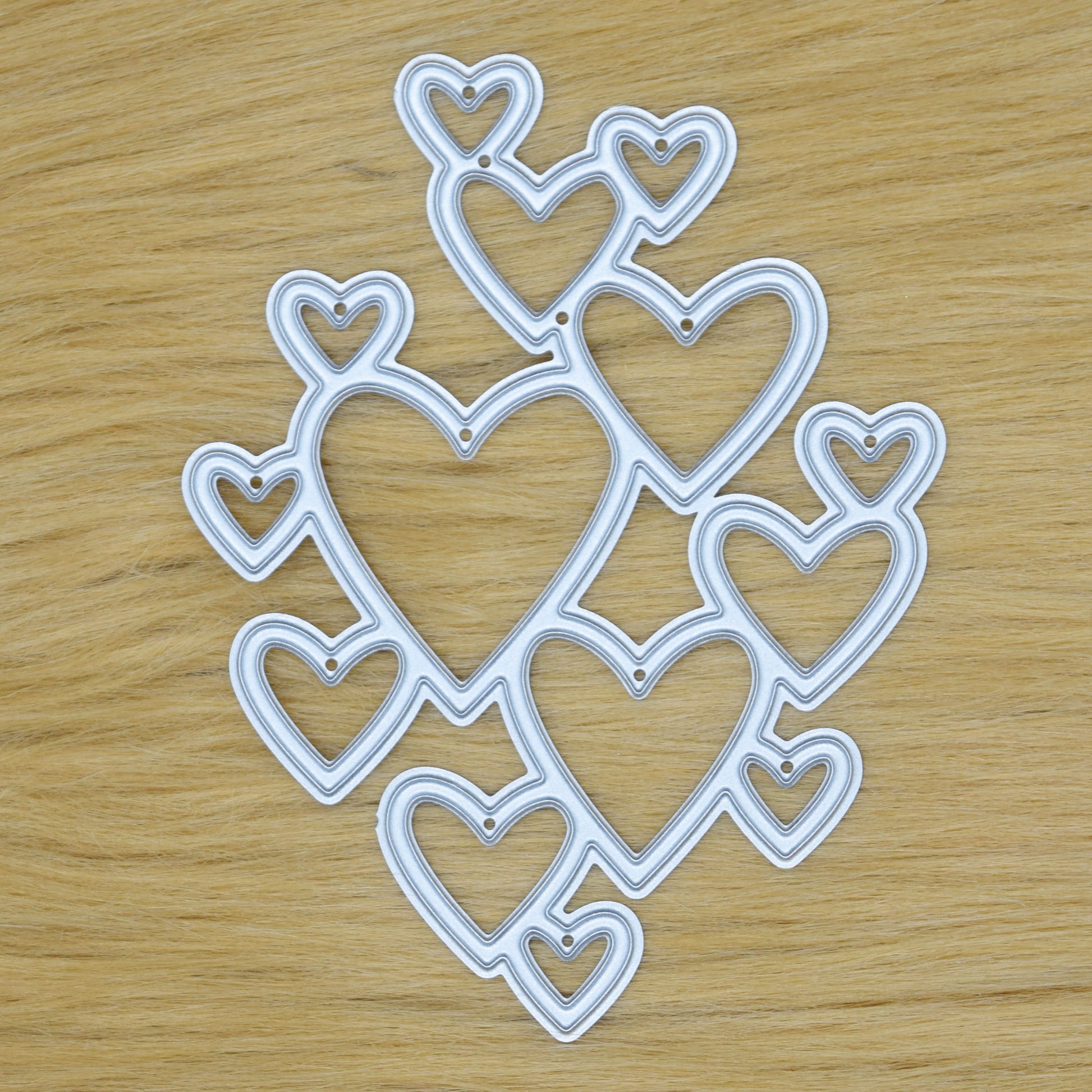 Heart cluster metal cutting die on faux fur background
