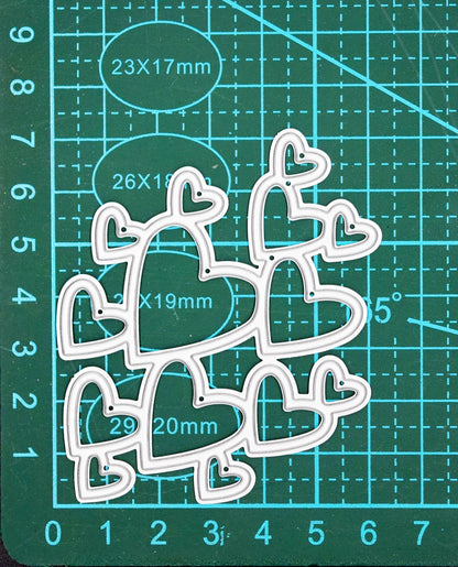 Heart cluster metal cutting die on cutting mat showing size