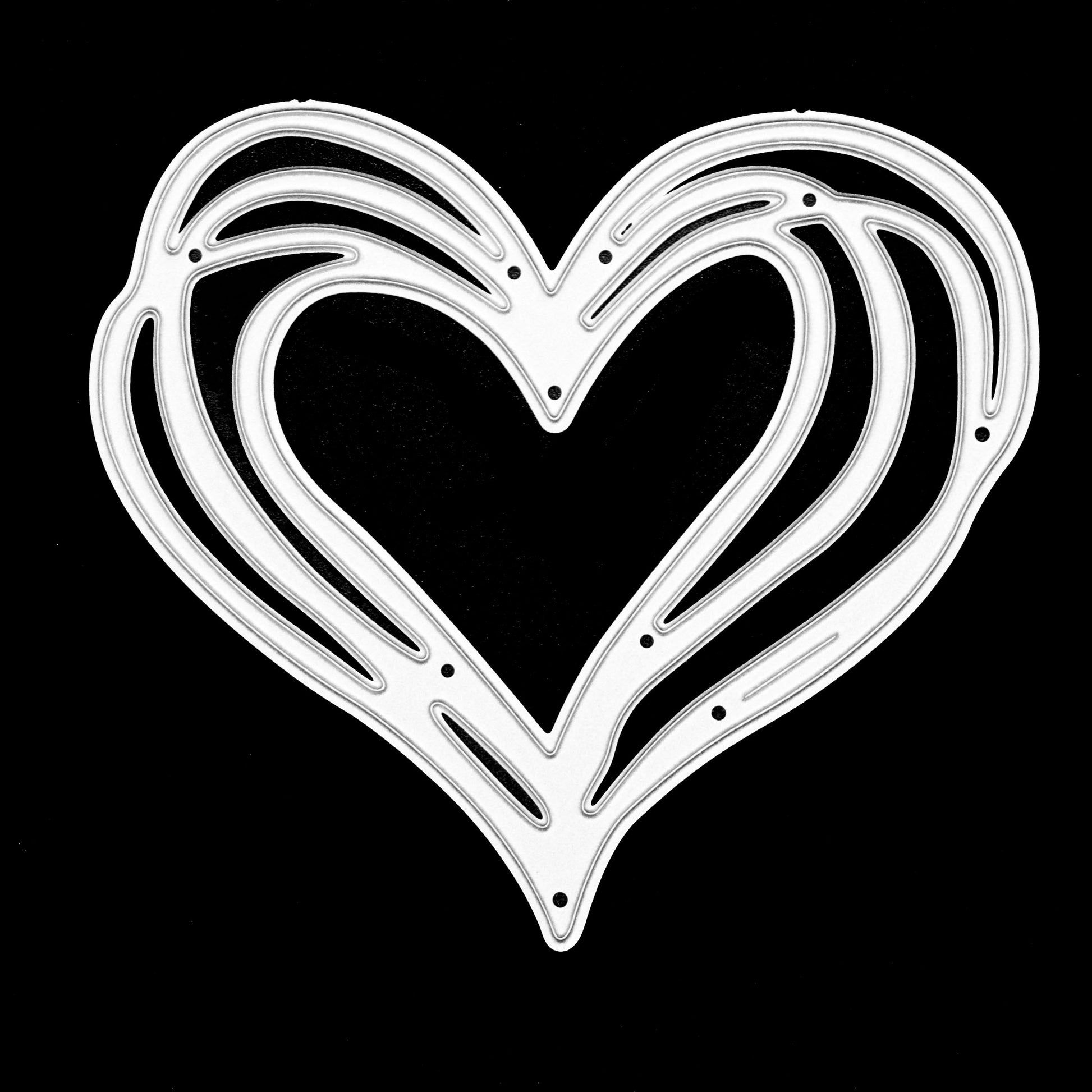 Heart metal cutting die on black background