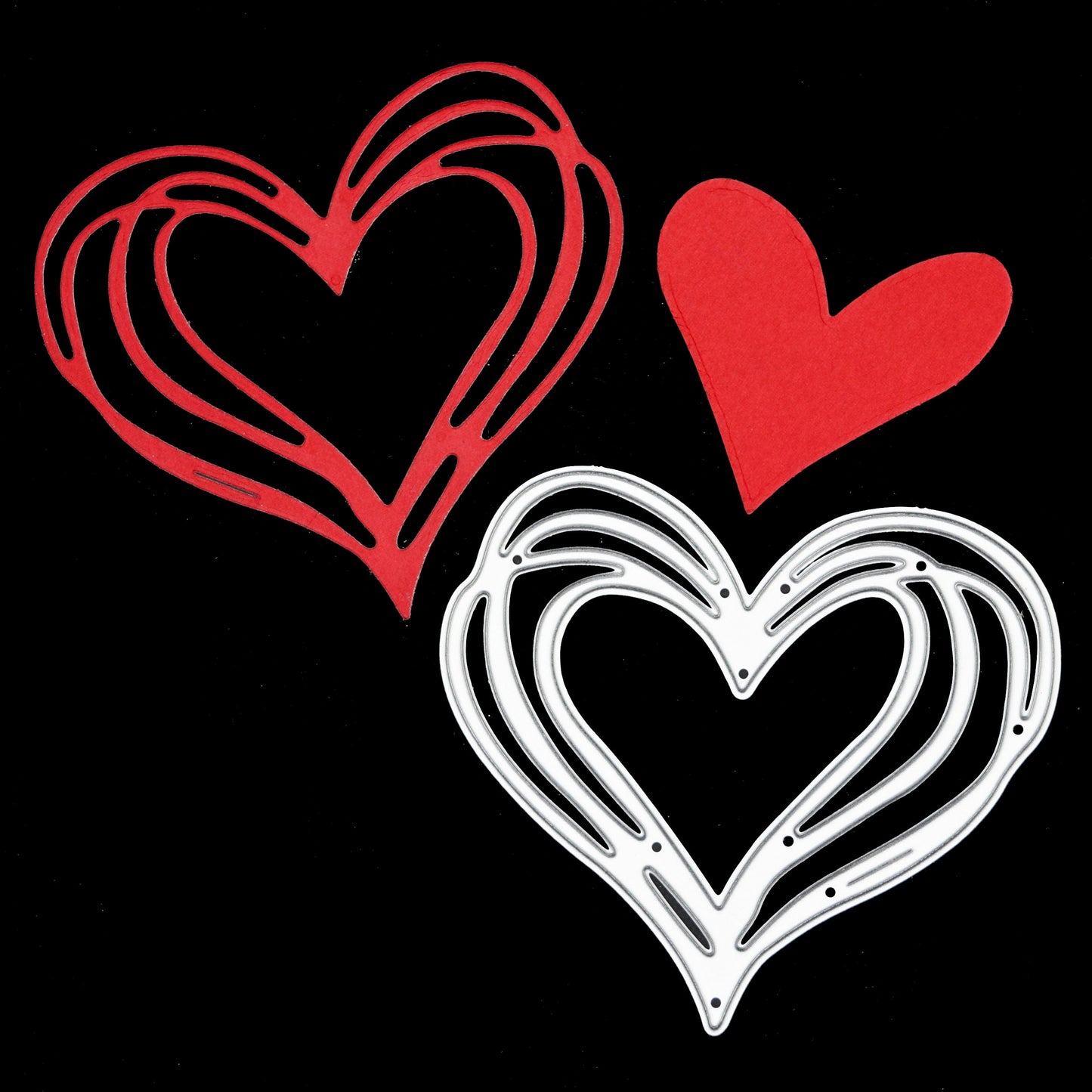 Heart metal cutting die with red cut example on black background