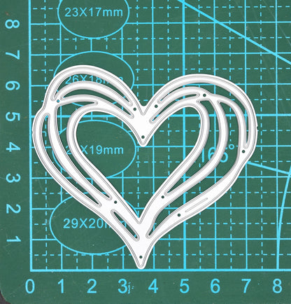 Heart metal cutting die on cutting mat showing size