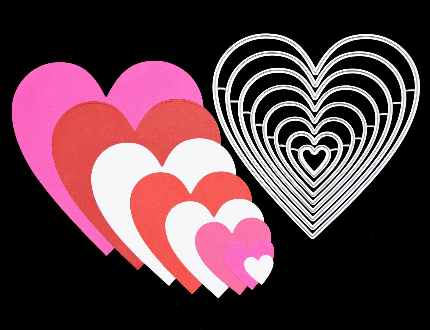 Close up of layered heart shapes cut from coloured card