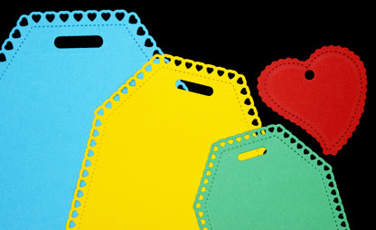 Heart tag die cut examples showing stitched edge and heart border