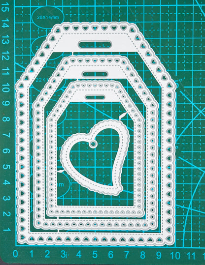 Heart tag metal cutting dies on cutting mat showing measurements