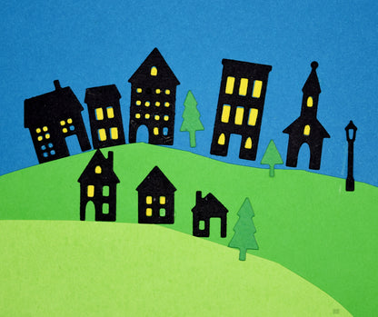 House and tree die cut scene with buildings, lamppost and landscape