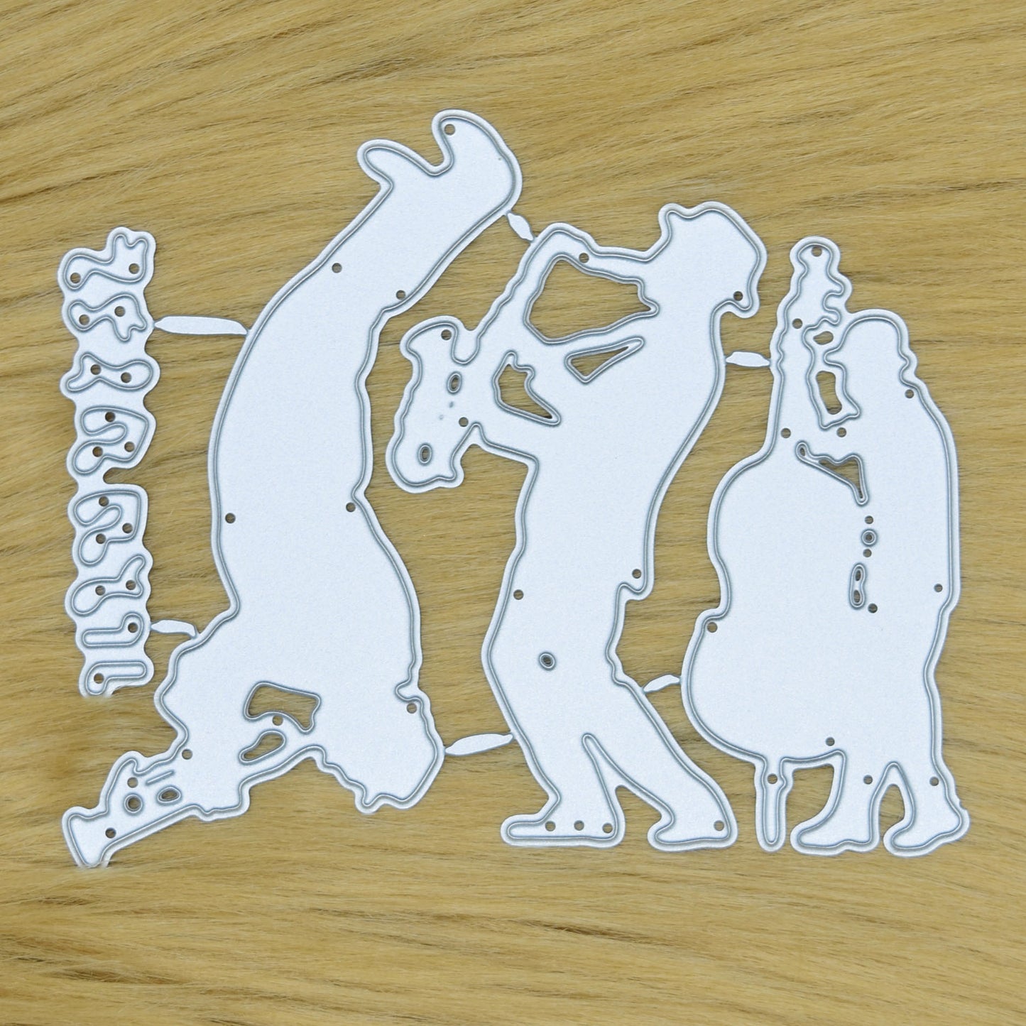 Jazz swing band and music notes metal cutting dies set displayed on a faux fur background for handmade cards, scrapbook layouts and papercraft projects.
