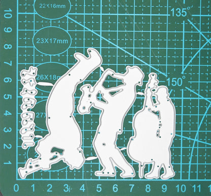 Jazz swing band and music notes metal cutting dies set displayed on a cutting mat to show scale for music-themed card making and paper crafting.