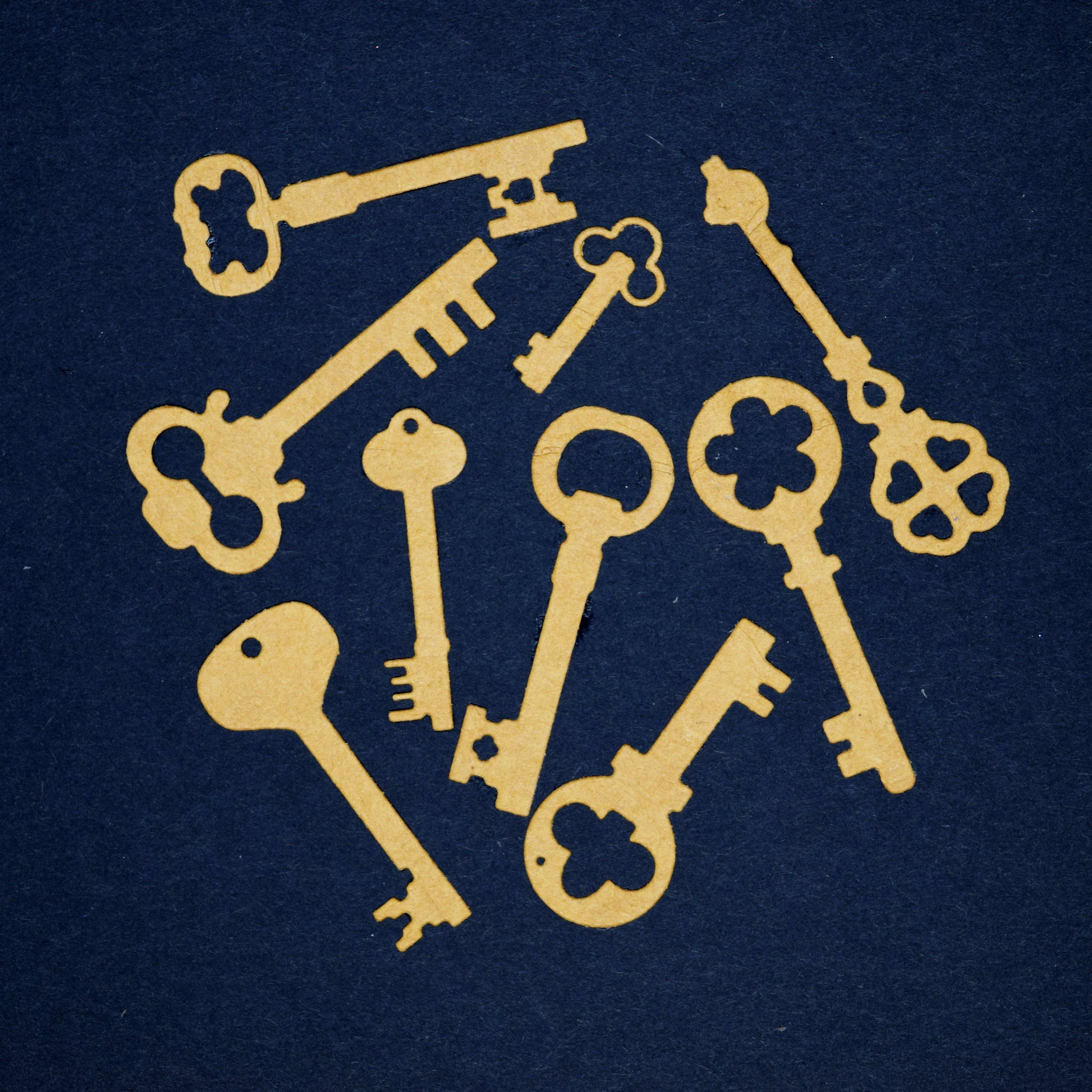 Vintage key die cut shapes cut from kraft card for steampunk themed cards scrapbooking and craft projects