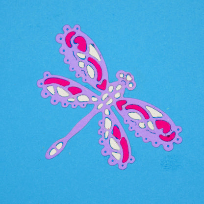 Decorative lace style dragonfly die cut in layered pink purple and white card for card making and papercraft projects