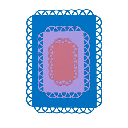 Layered blue, lilac and pink cardstock panels created with decorative lace edge rectangle metal cutting dies.