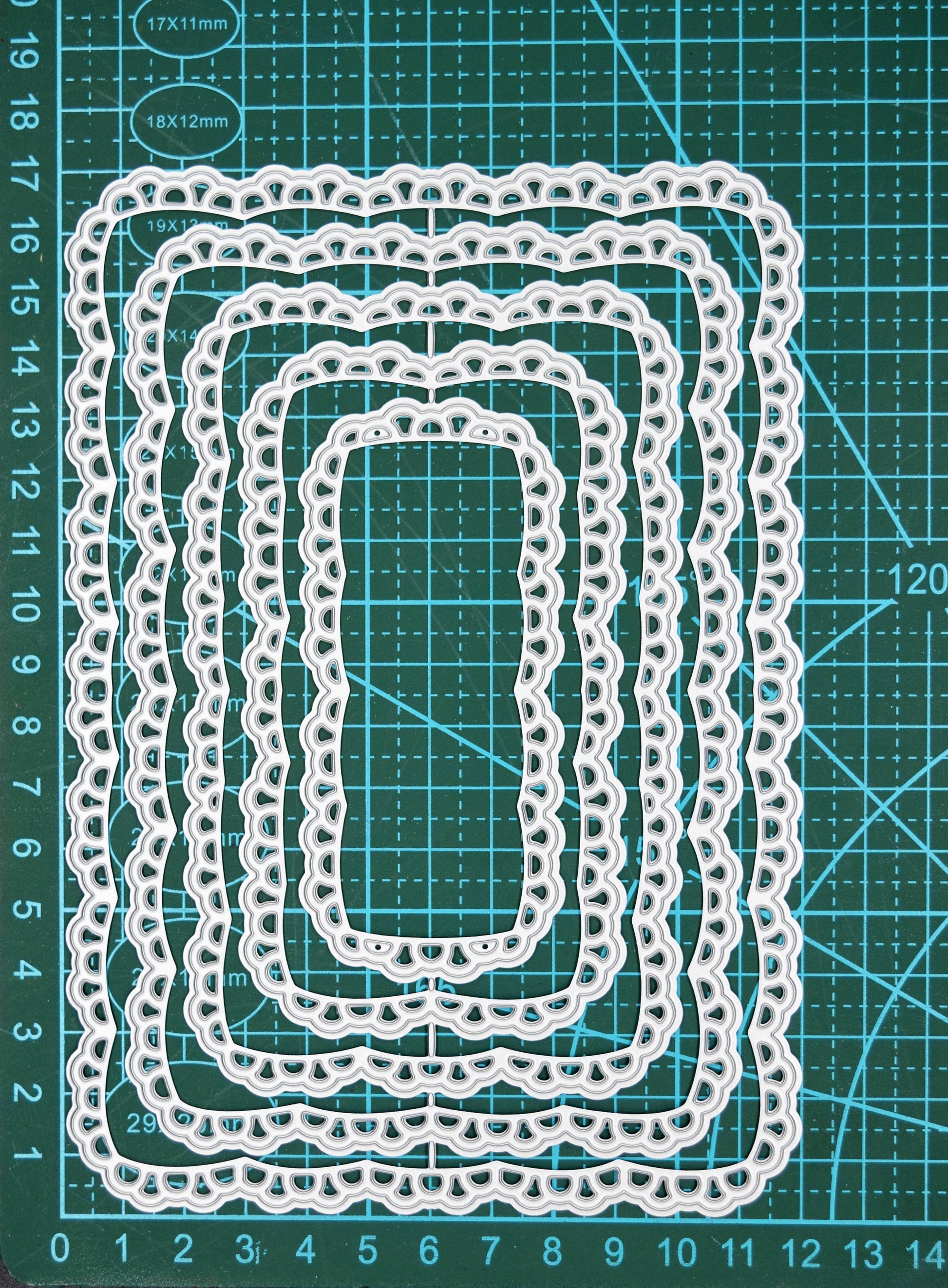 Lace rectangle nesting dies on cutting mat showing size