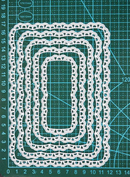 Lace rectangle nesting dies on cutting mat showing size