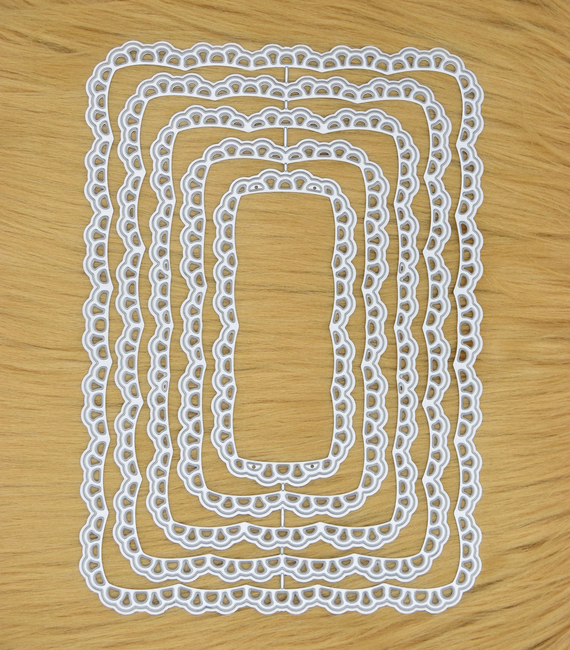 Lace rectangle nesting dies on faux fur background