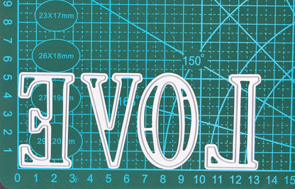 Large uppercase alphabet metal cutting dies shown on a cutting mat for size reference