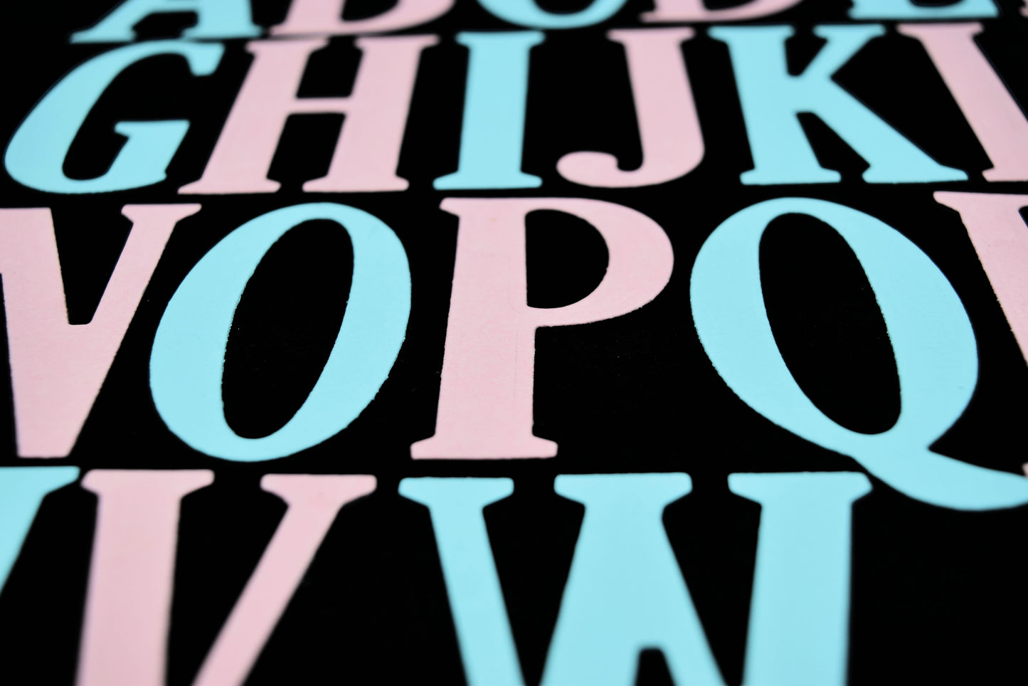 Close-up of coloured uppercase alphabet die cuts showing the clean cut detail