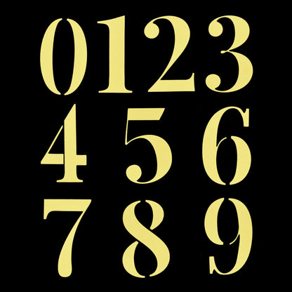 Yellow number die cuts from 0 to 9 arranged on a black background for card making and papercraft