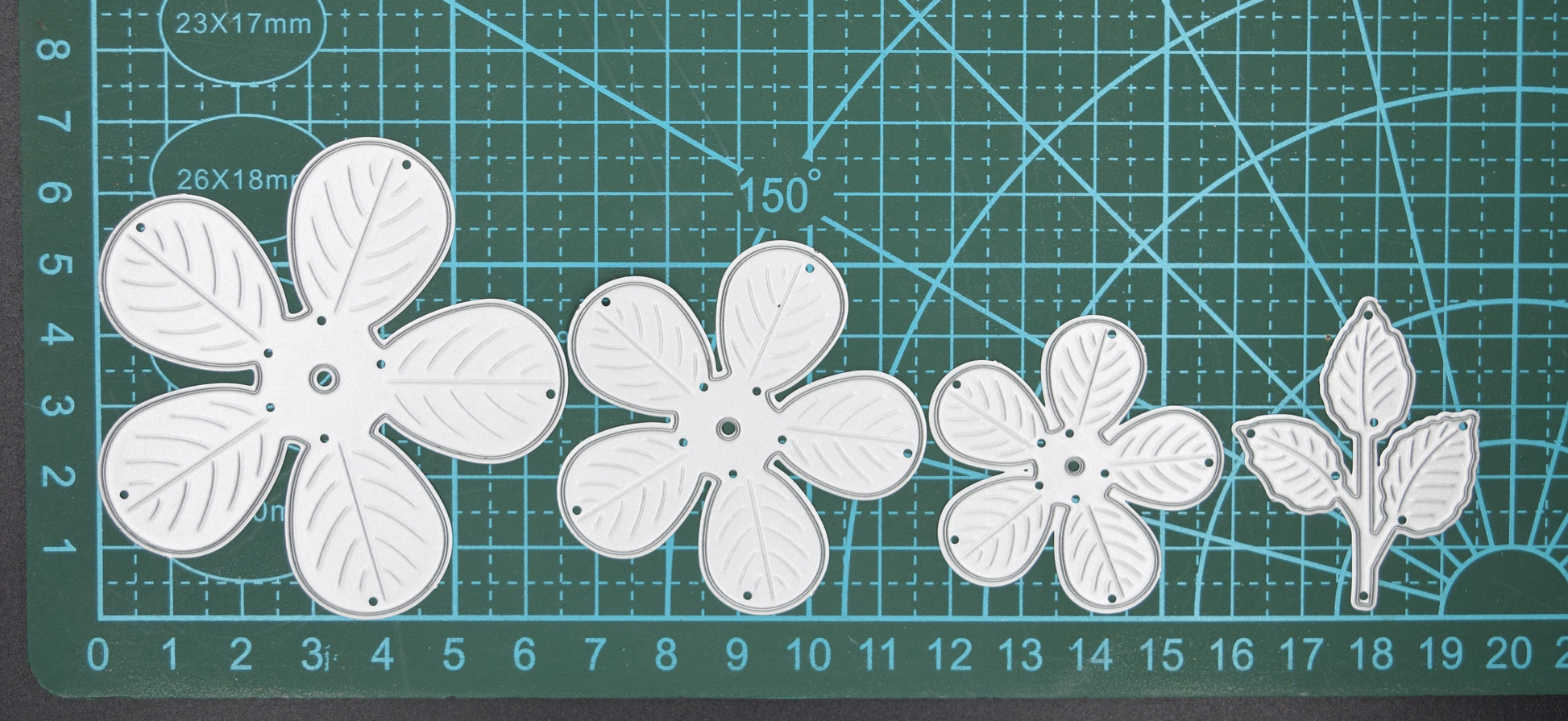 Layered flower metal cutting dies showing graduated petal sizes for 3D flower making