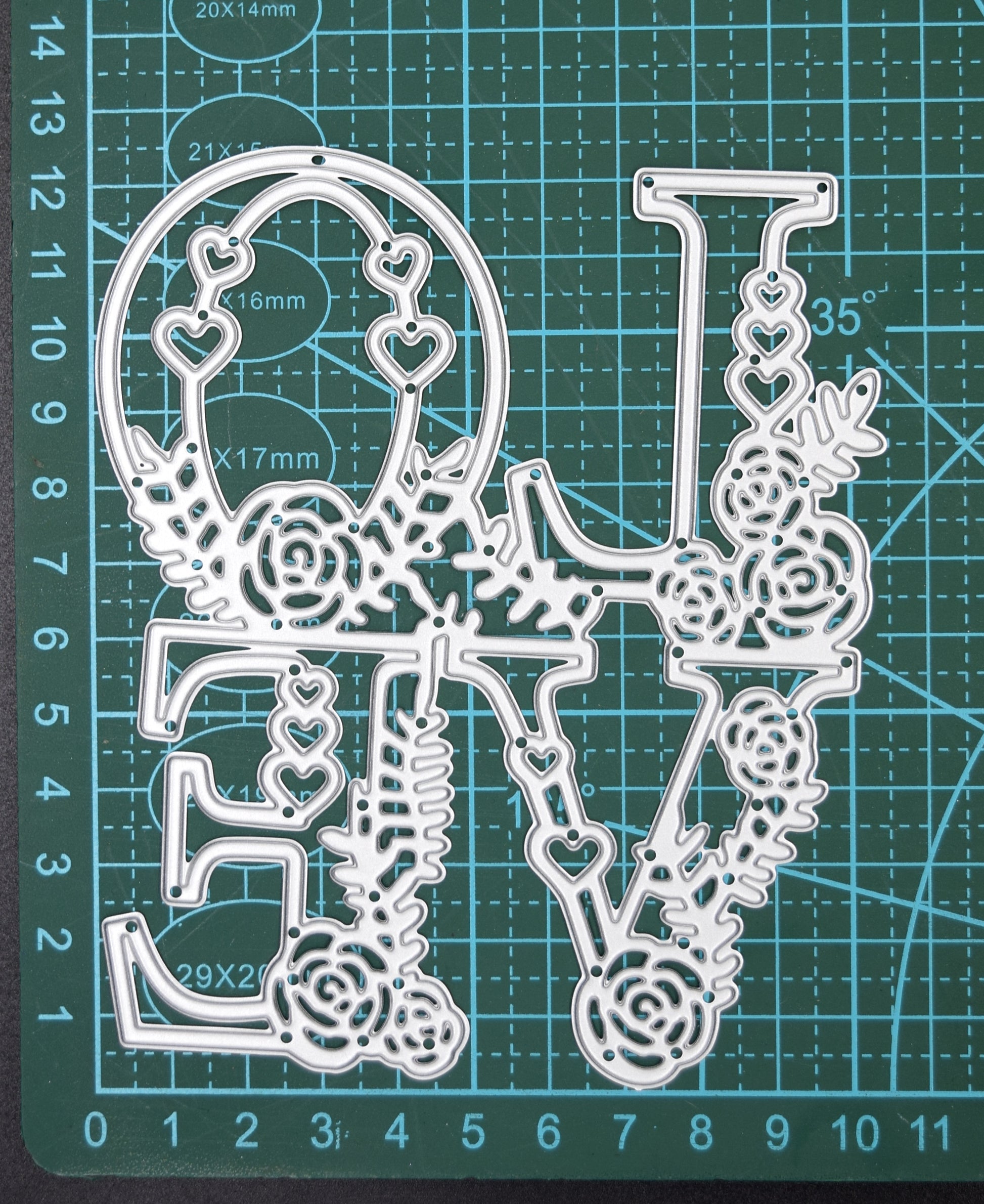 Floral LOVE metal cutting die on cutting mat showing approximate size and layout