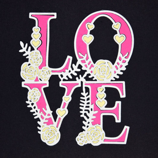 Finished LOVE die cut with floral and heart details in layered cardstock for card making
