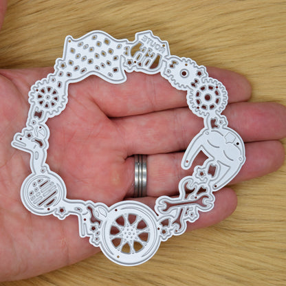 Motorbike frame metal cutting die held in hand showing size