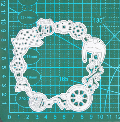 Motorbike circular frame die on cutting mat showing measurements