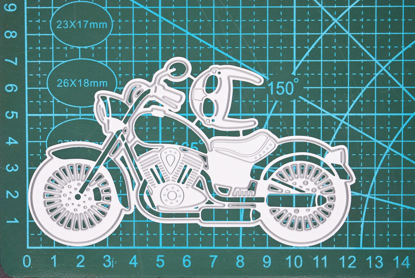 Motorbike cutting die on measuring mat showing approximate size