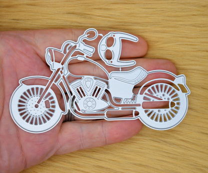 Motorcycle metal cutting die held in hand for size reference