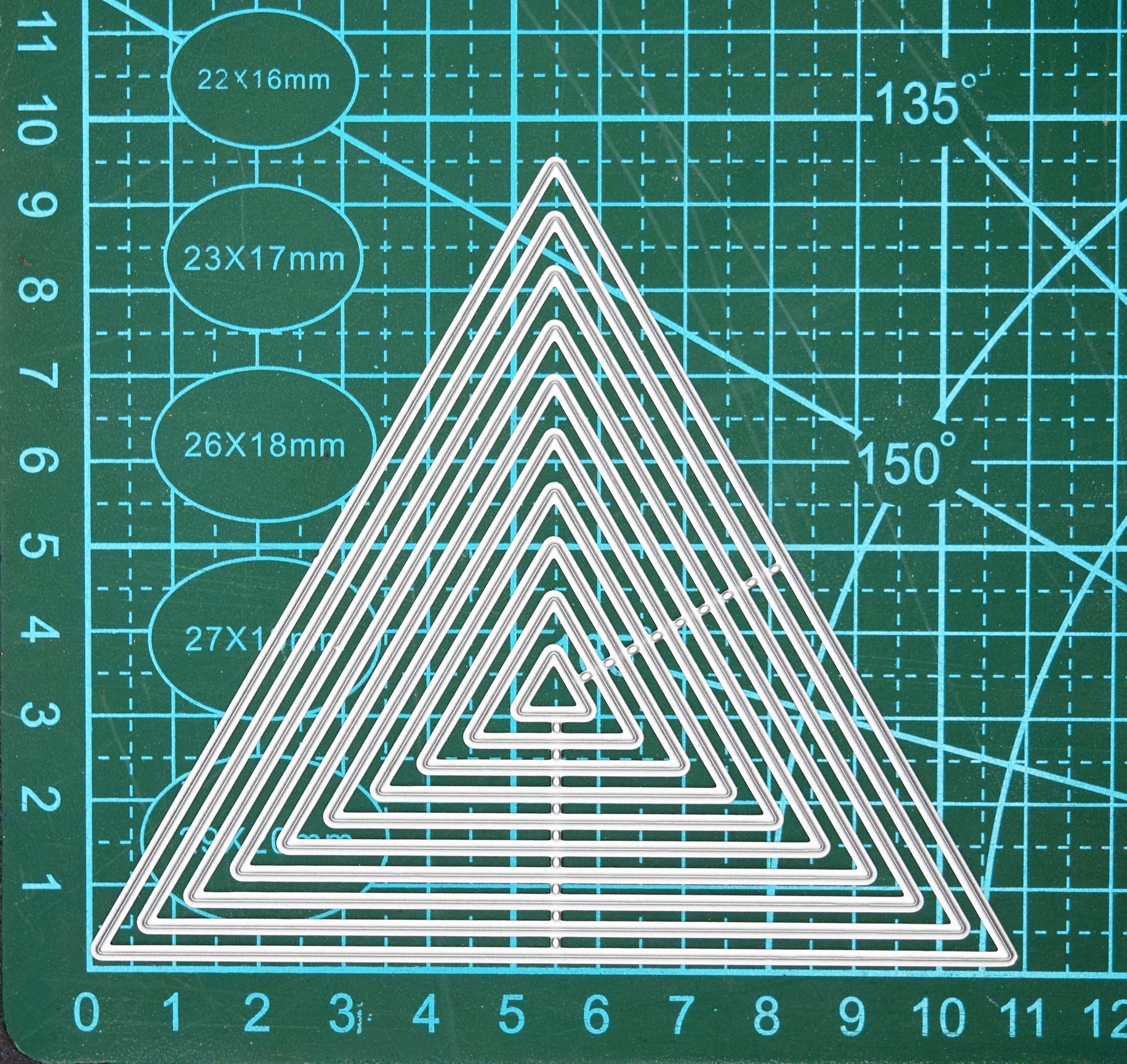Nest of triangle metal cutting dies size reference on cutting mat for card making