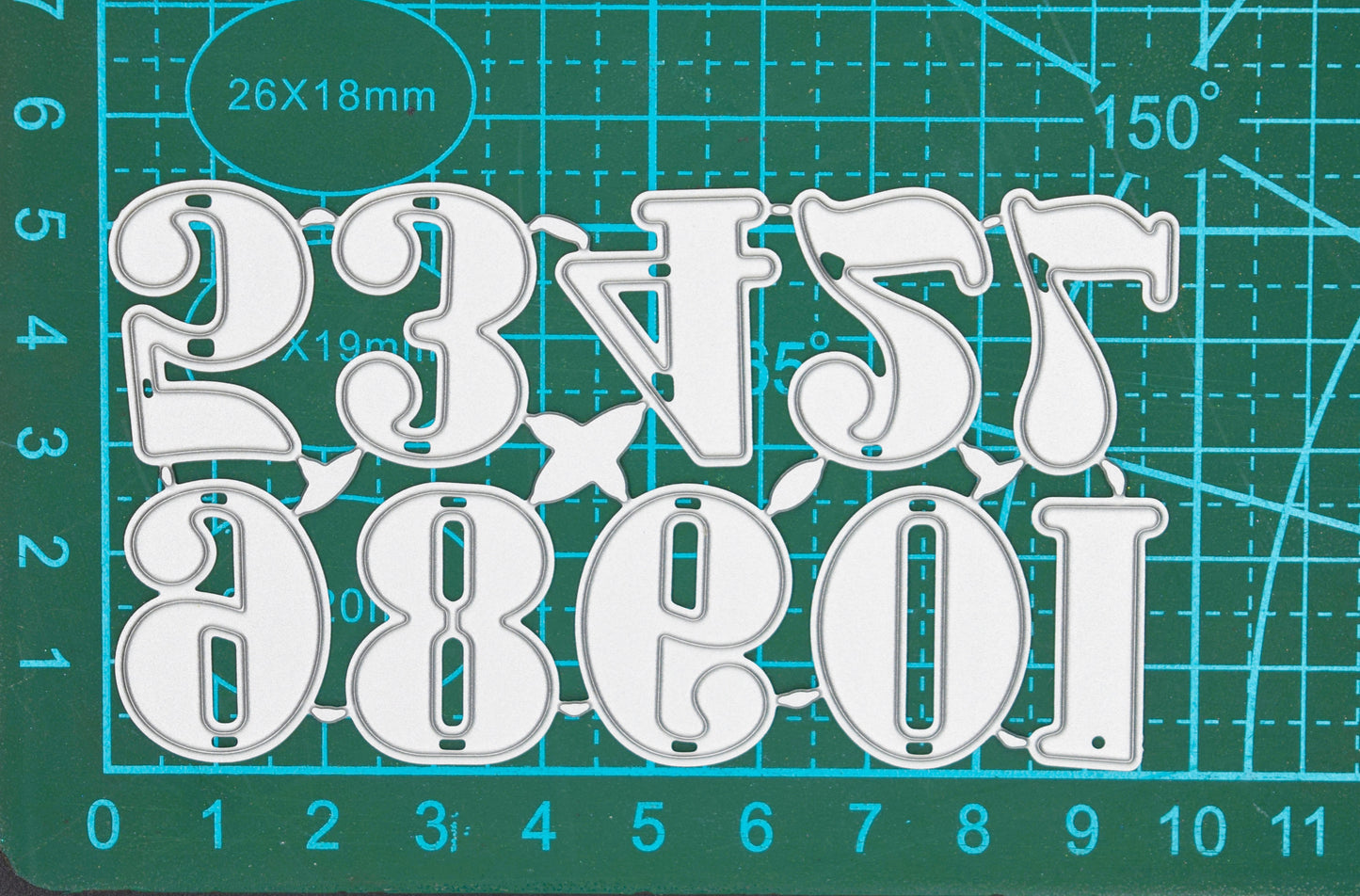 Decorative number metal cutting dies on cutting mat showing approximate size for card making projects