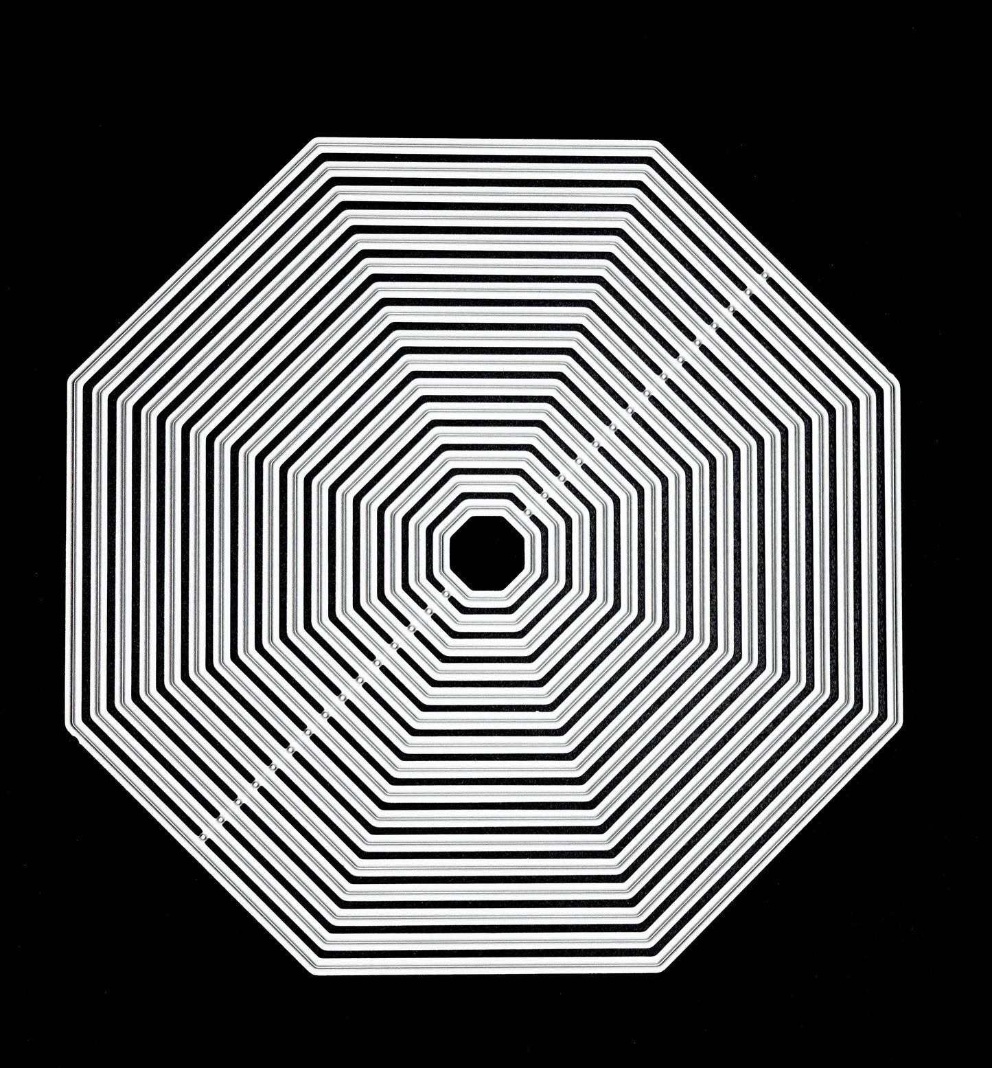 Octagon metal cutting dies nesting set on black background