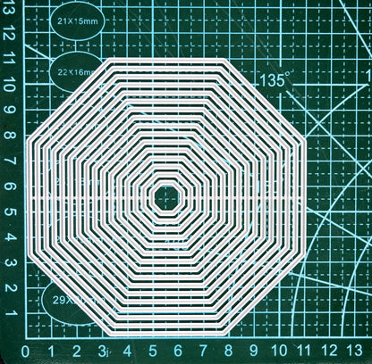 Octagon nesting dies on cutting mat showing measurements