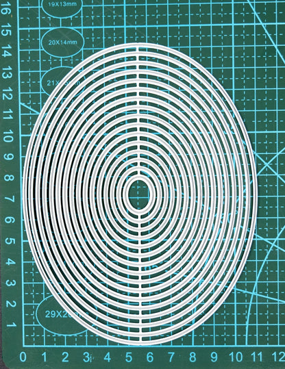 Oval nesting dies set on cutting mat showing size and scale