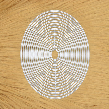 Oval nesting metal cutting dies set on faux fur background