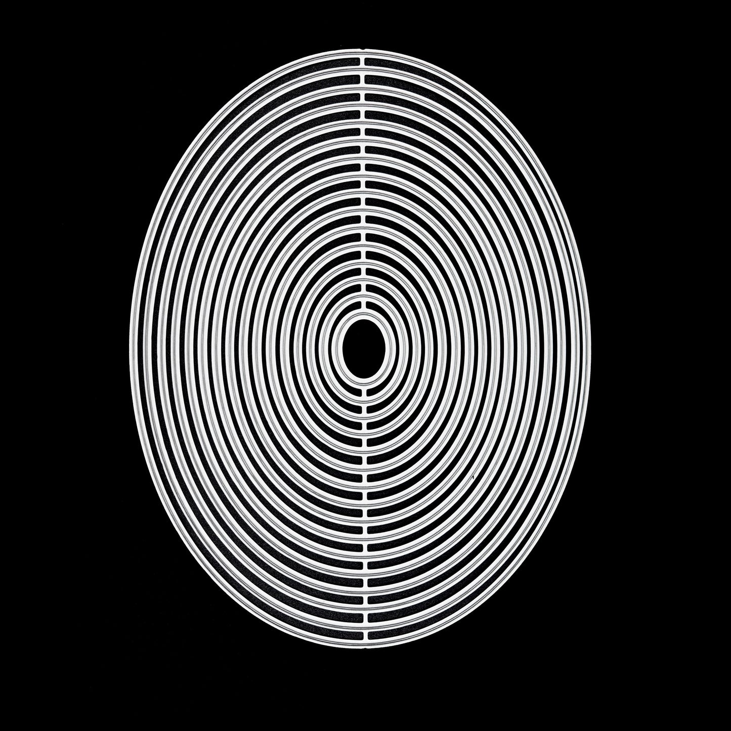 Oval nesting metal cutting dies set on black background