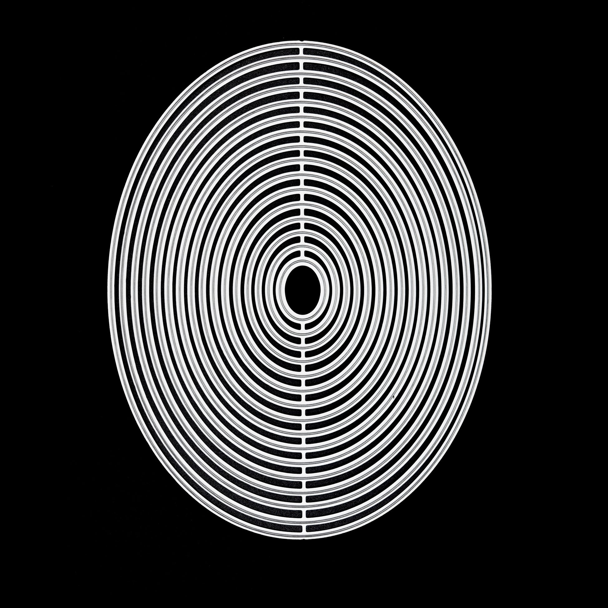 Oval nesting metal cutting dies set on black background