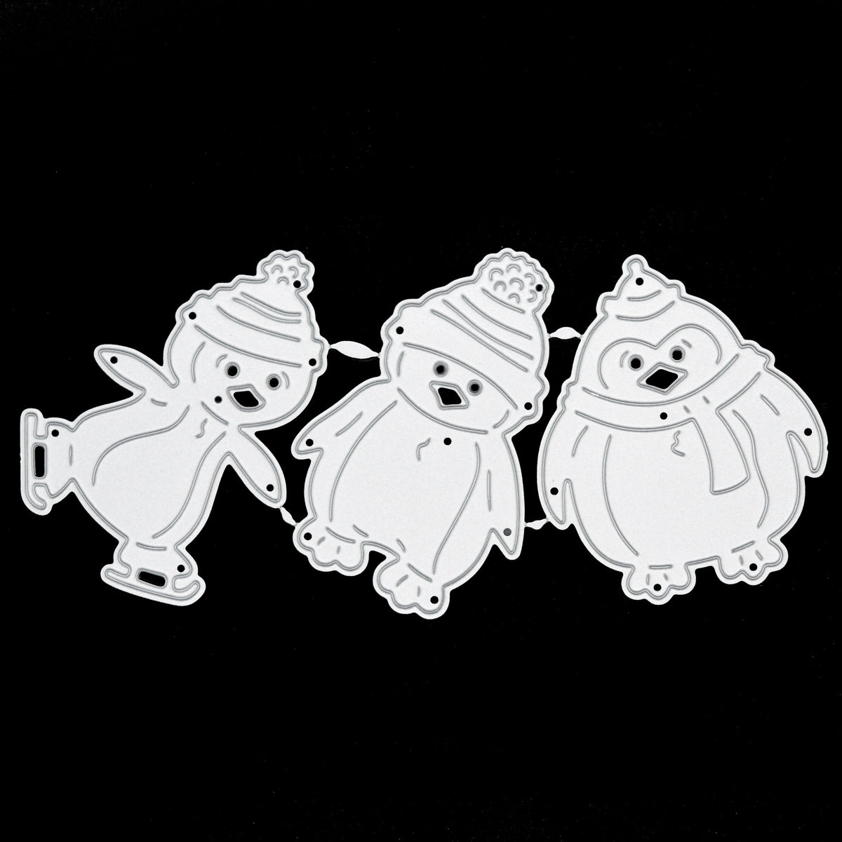 Penguin metal cutting dies displayed on black background for craft projects
