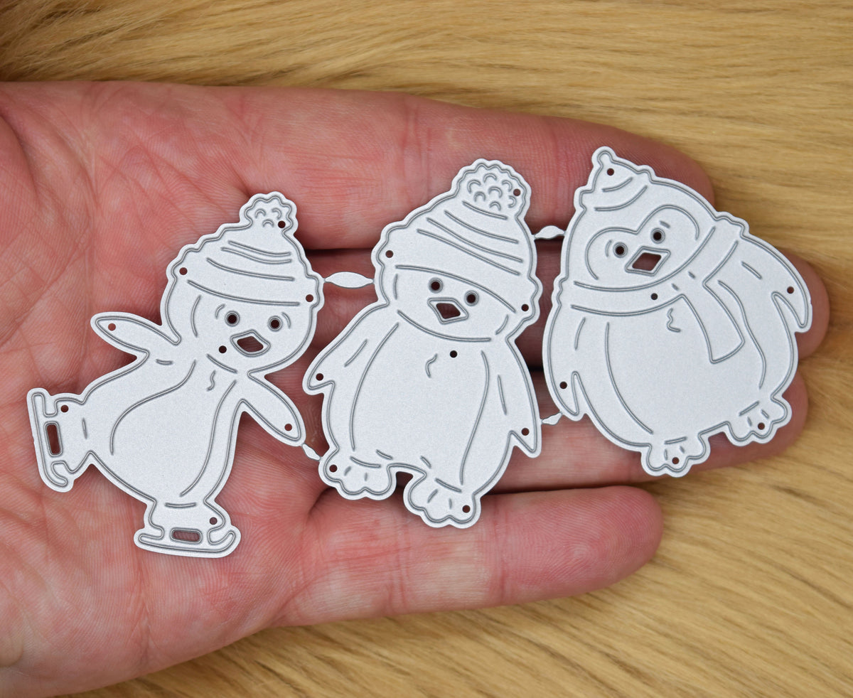 Christmas penguin metal cutting dies set with three festive penguin designs