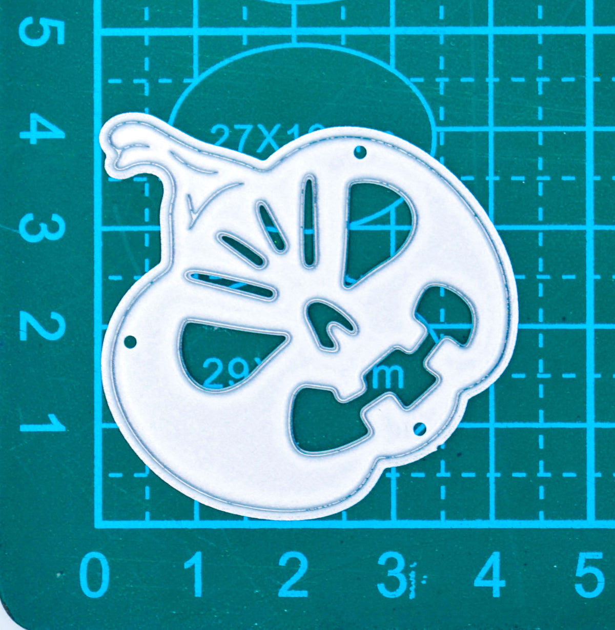 Halloween pumpkin metal cutting die shown on a centimetre cutting mat for size reference, suitable for card making and papercraft.