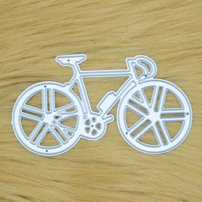 Racing bicycle metal cutting die displayed on a soft faux fur background for card making, scrapbooking and cycling-themed papercraft.