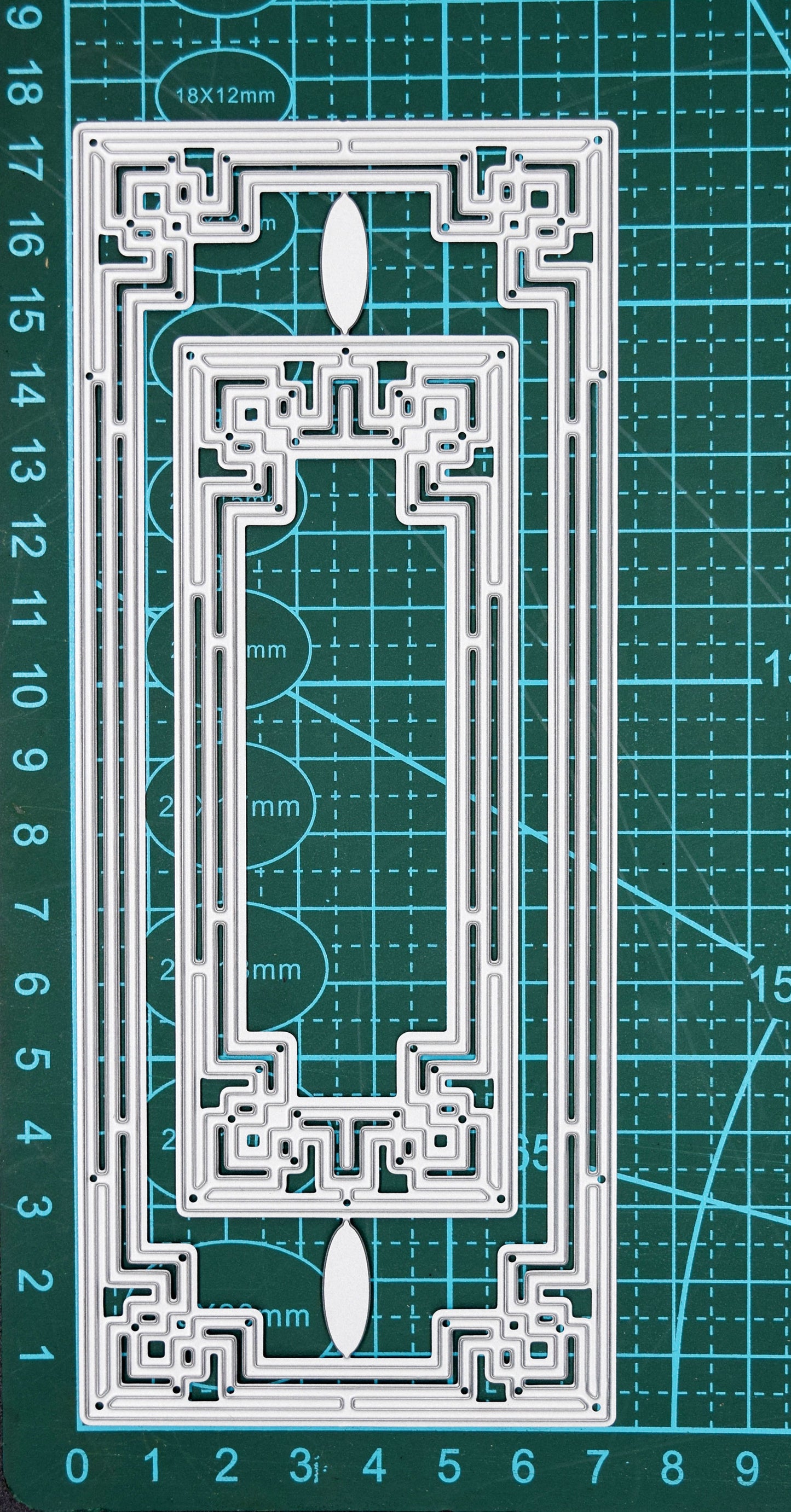 Art Deco rectangle frame dies on cutting mat showing size