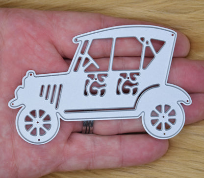 Vintage retro car cutting die shown in hand for size reference